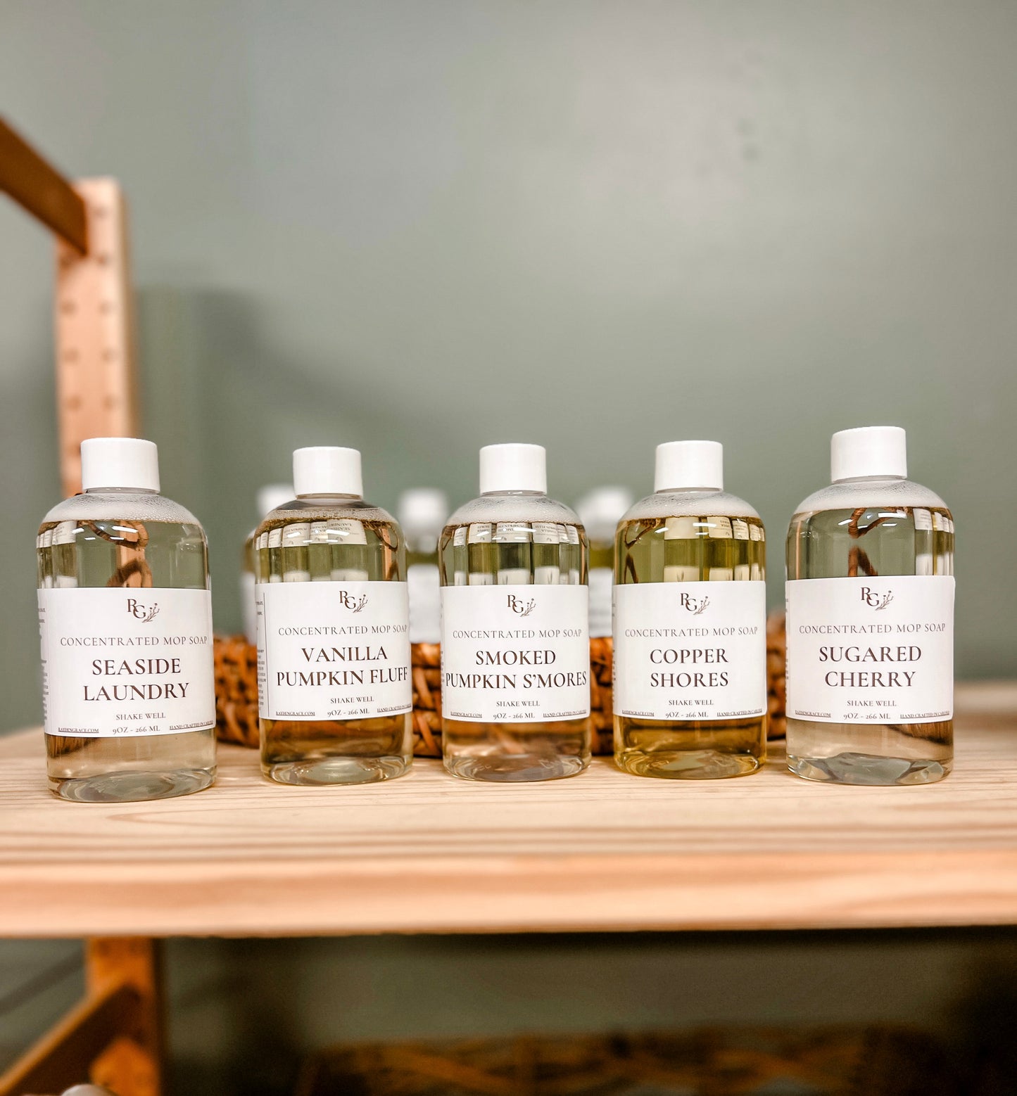 5 clear bottles of rayden + grace mop soap