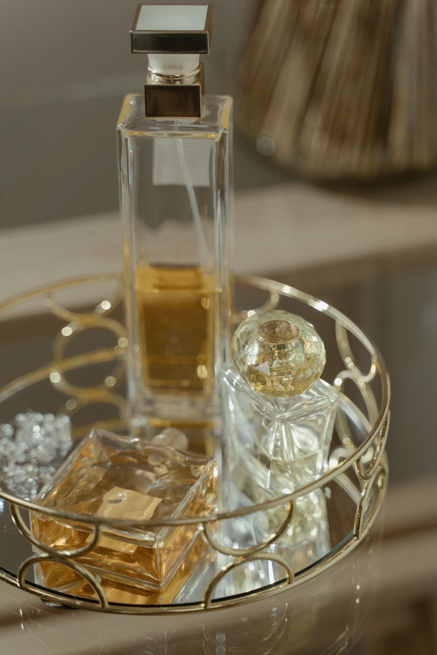 close up of perfume bottles on a vanity