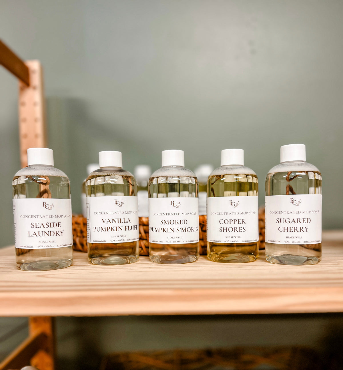 5 clear bottles of rayden + grace mop soap
